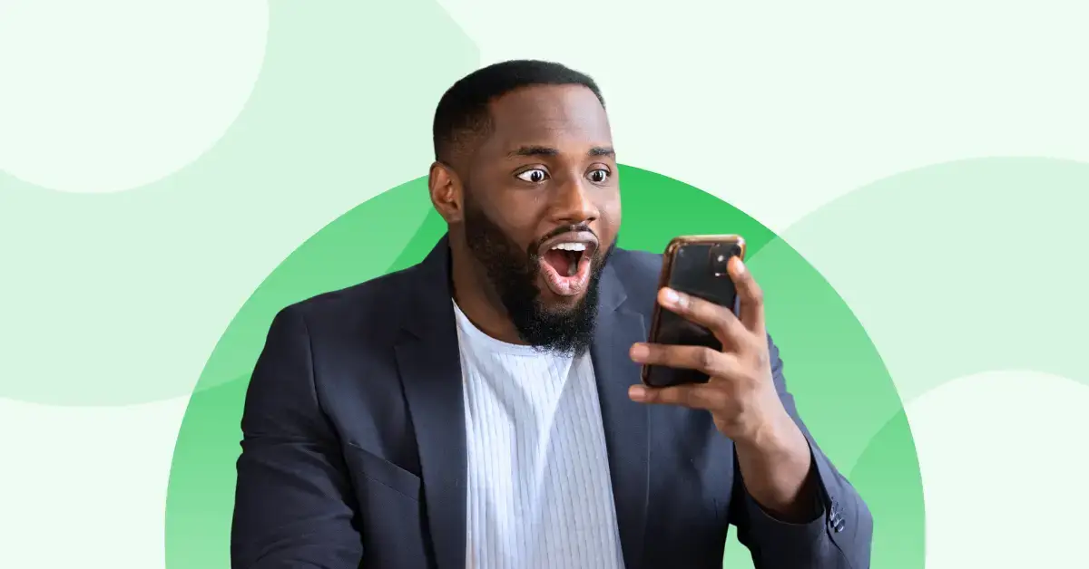 Man looks with amazement at his cellphone